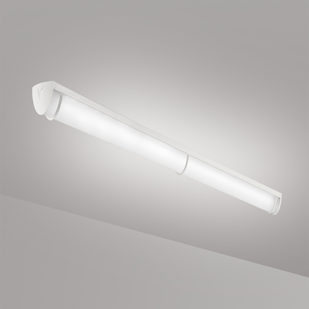 A luminous ceiling or surface-mounted luminaire with a curved linear diffuser body and trim accents