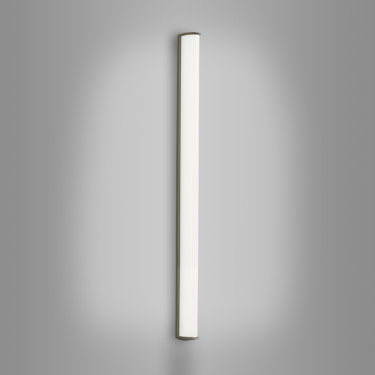 A luminous surface-mounted luminaire with a curved linear diffuser body