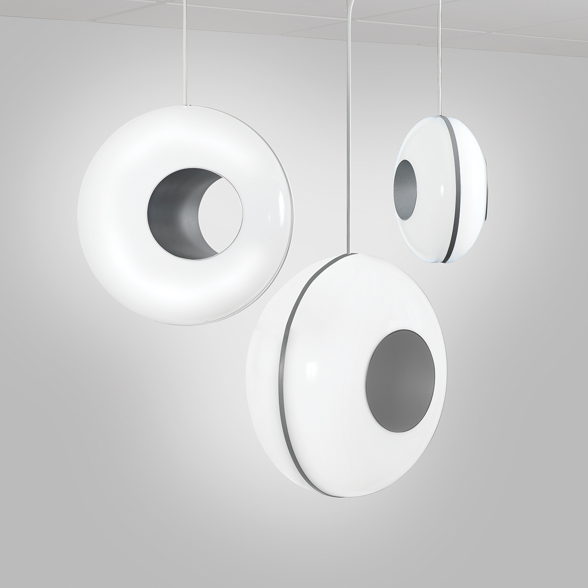 Spherical luminous pendants with circular asymmetric holes