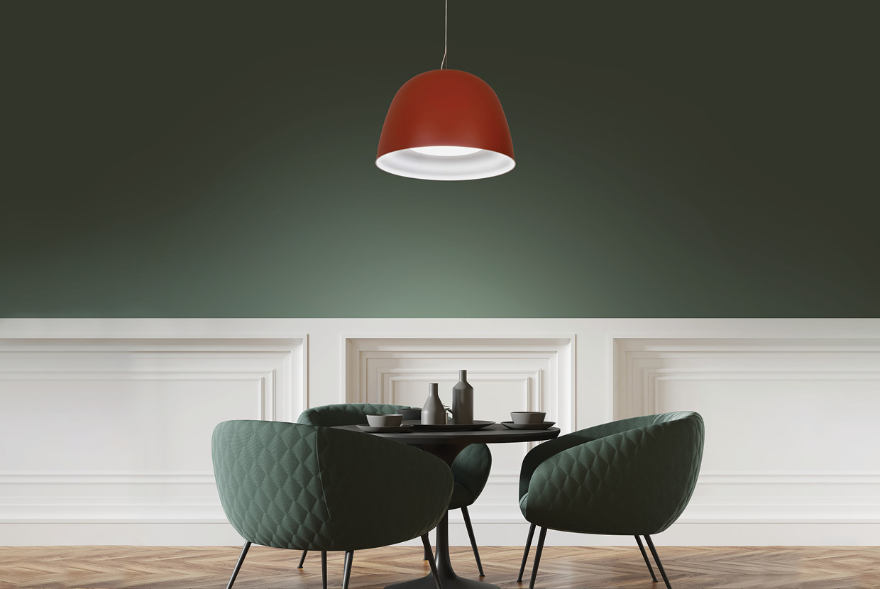 LED suspended bell pendant light hanging over cafe table with green chairs