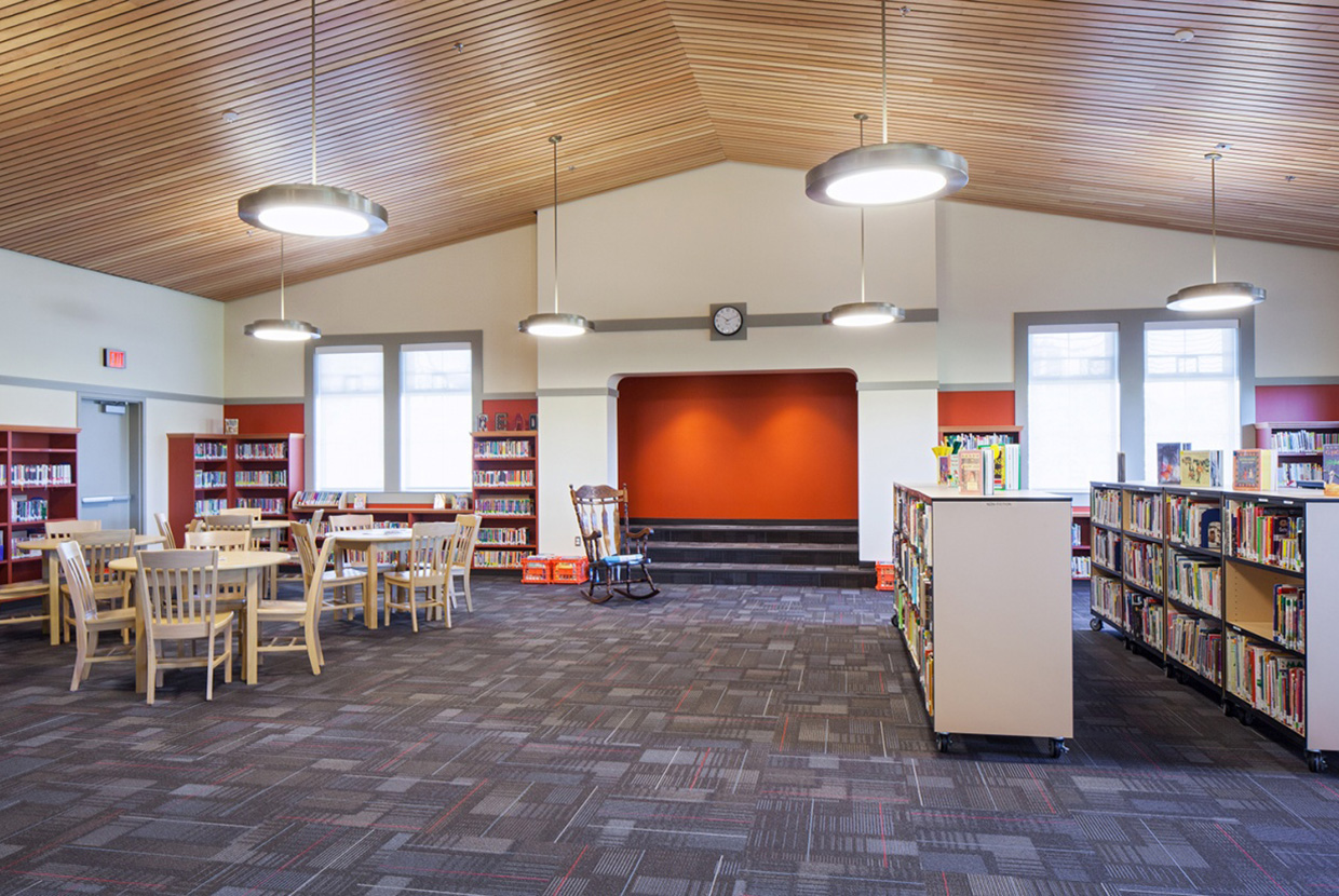 Broadway pendants are perfect for classroom lighting, seen here above a modern school library. 
