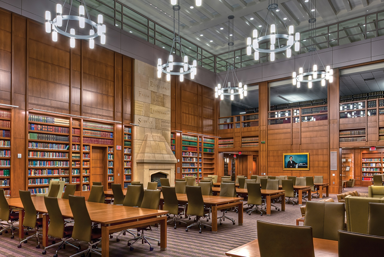 Sequence pendants in a circular configuration for a stylish entryway in a library lighting design. 