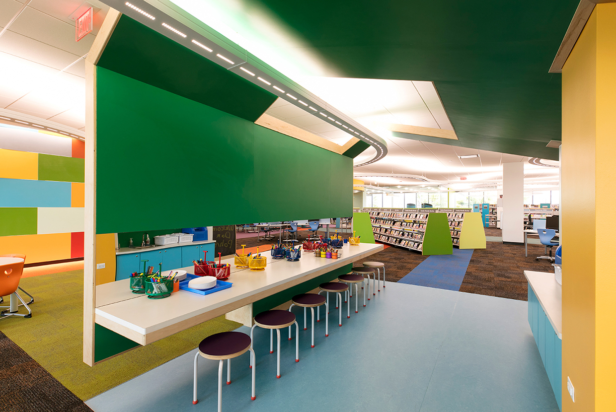 Infinity Performance configurable pendant in educational interior design above school classroom. 