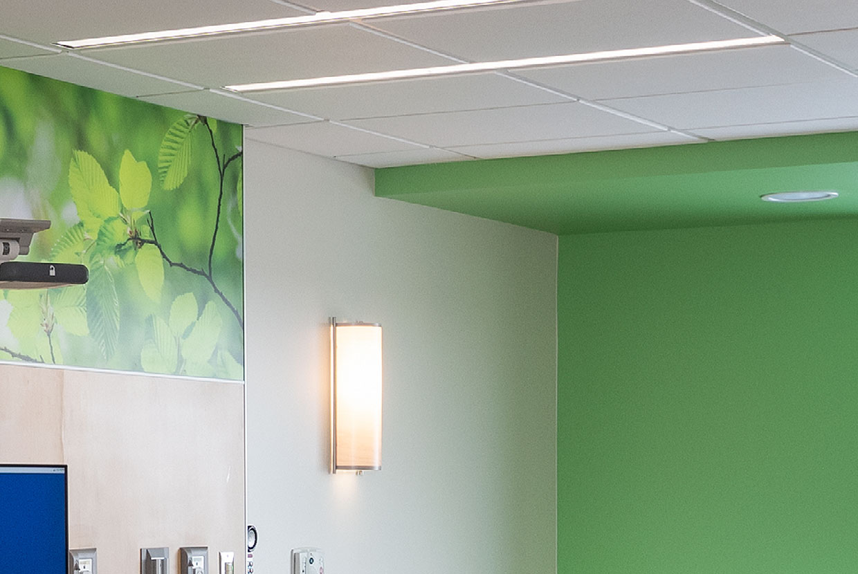 A thin dual unity overbed luminaire for patient lighting