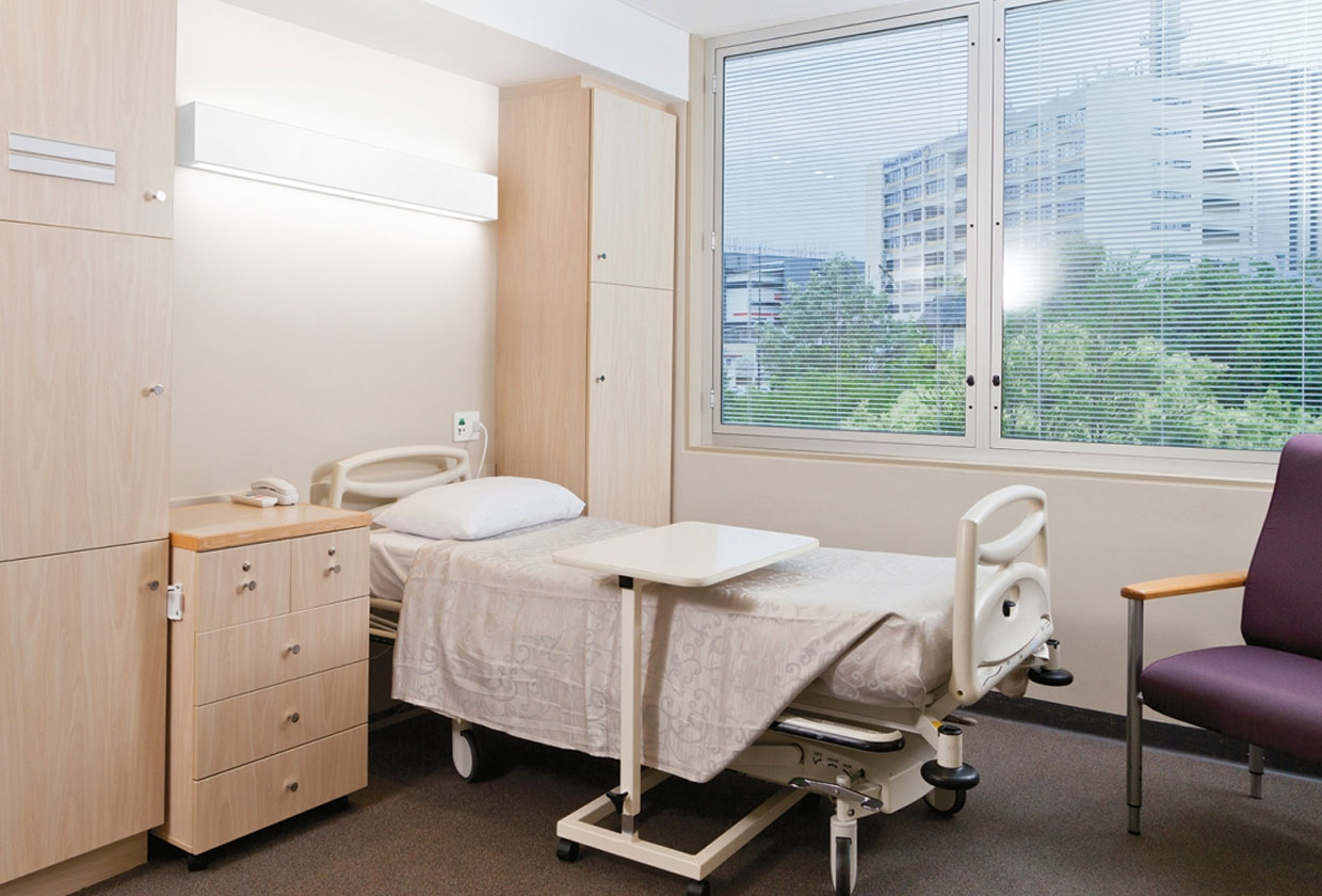 Linear Art Sconce In Patient Room Above Bed