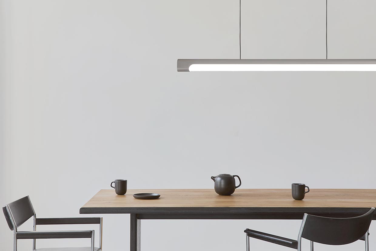 The sleek Nacelle linear pendant light fixture breaks out of the monotony of most linear suspended lights, delivering softer lighting.