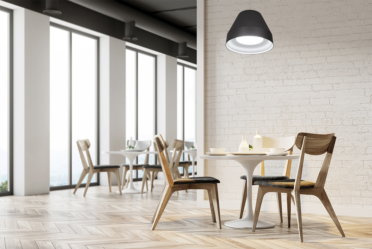 Black modern bell pendant provides quality LED light to hospitality lunchroom. 