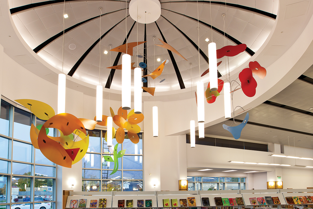 Sequence pendants in a circular configuration for a stylish central feature in a library lighting design. 