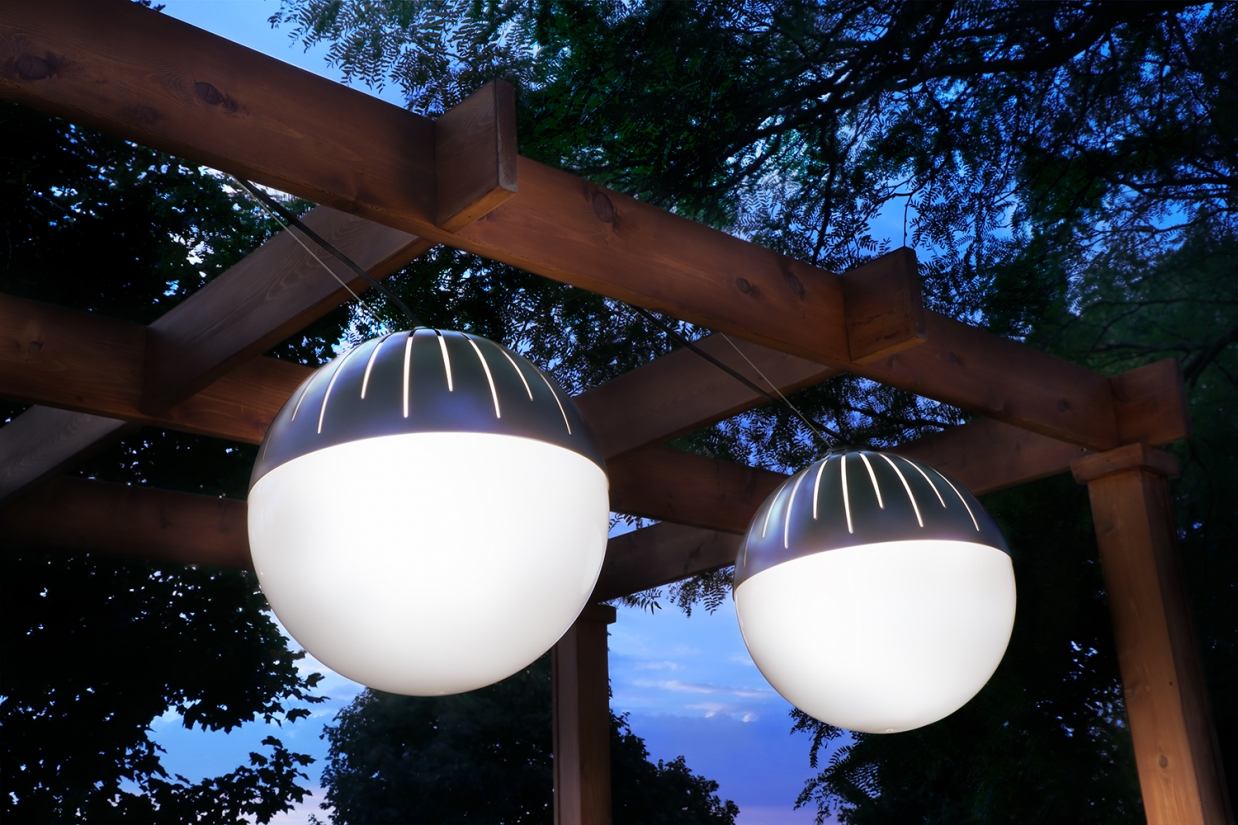 Zume Outdoor Lights Outside at Night Hanging from Wooden Structure