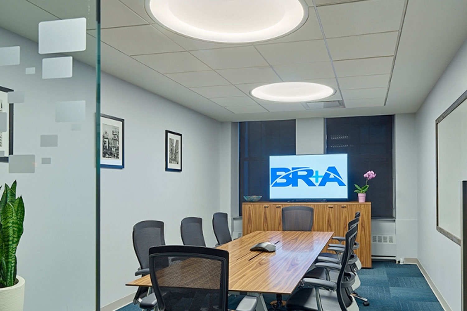 Two Large Symmetry Lights above a space for office meetings