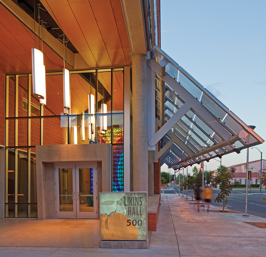 Air Foil large pendants bring light to educational interior design, shining from a college building's entryway.