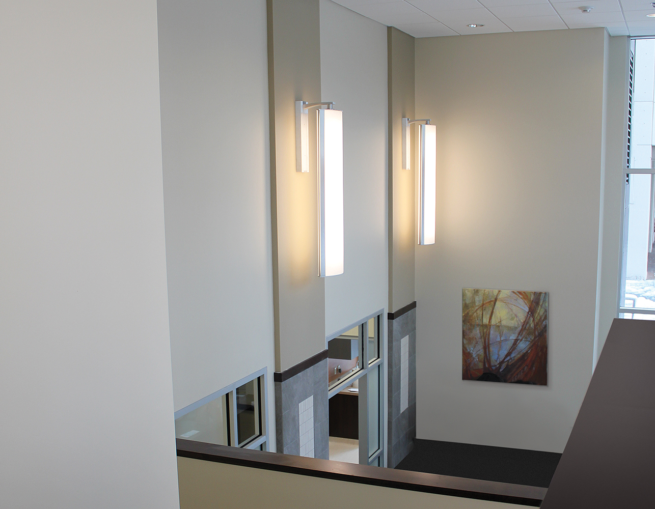 Air Foil pendants can complement healthcare design in lobbies, shown here as a sconce above doorways.
