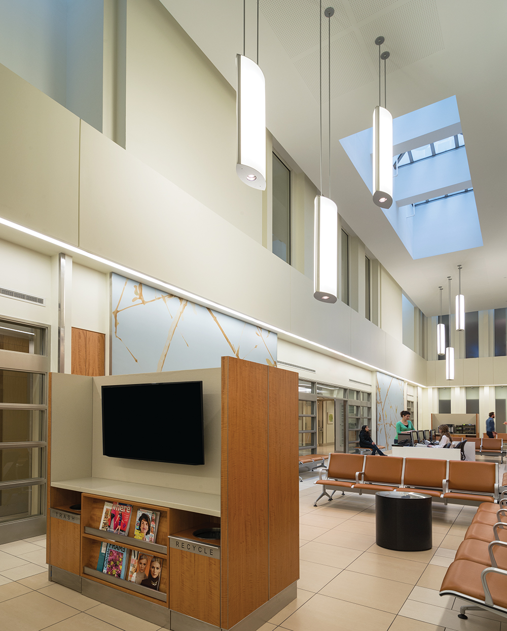 Air Foil pendants hung in a large waiting room for eye-catching hospital lighting design.