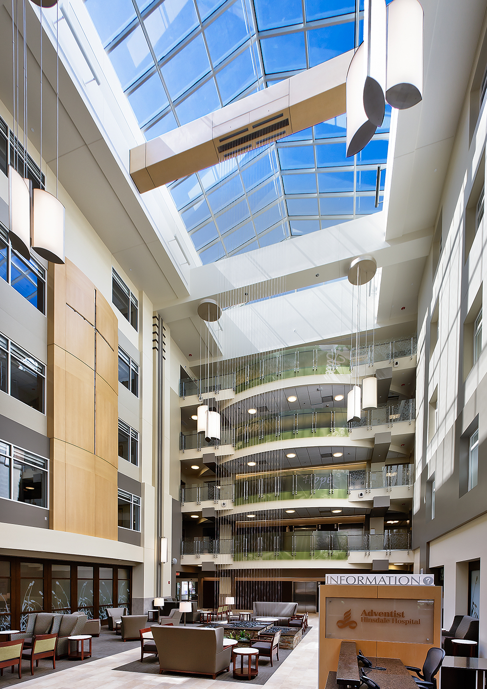 Air Foil pendants in a hospital lighting its large atrium with clean, diffused light.