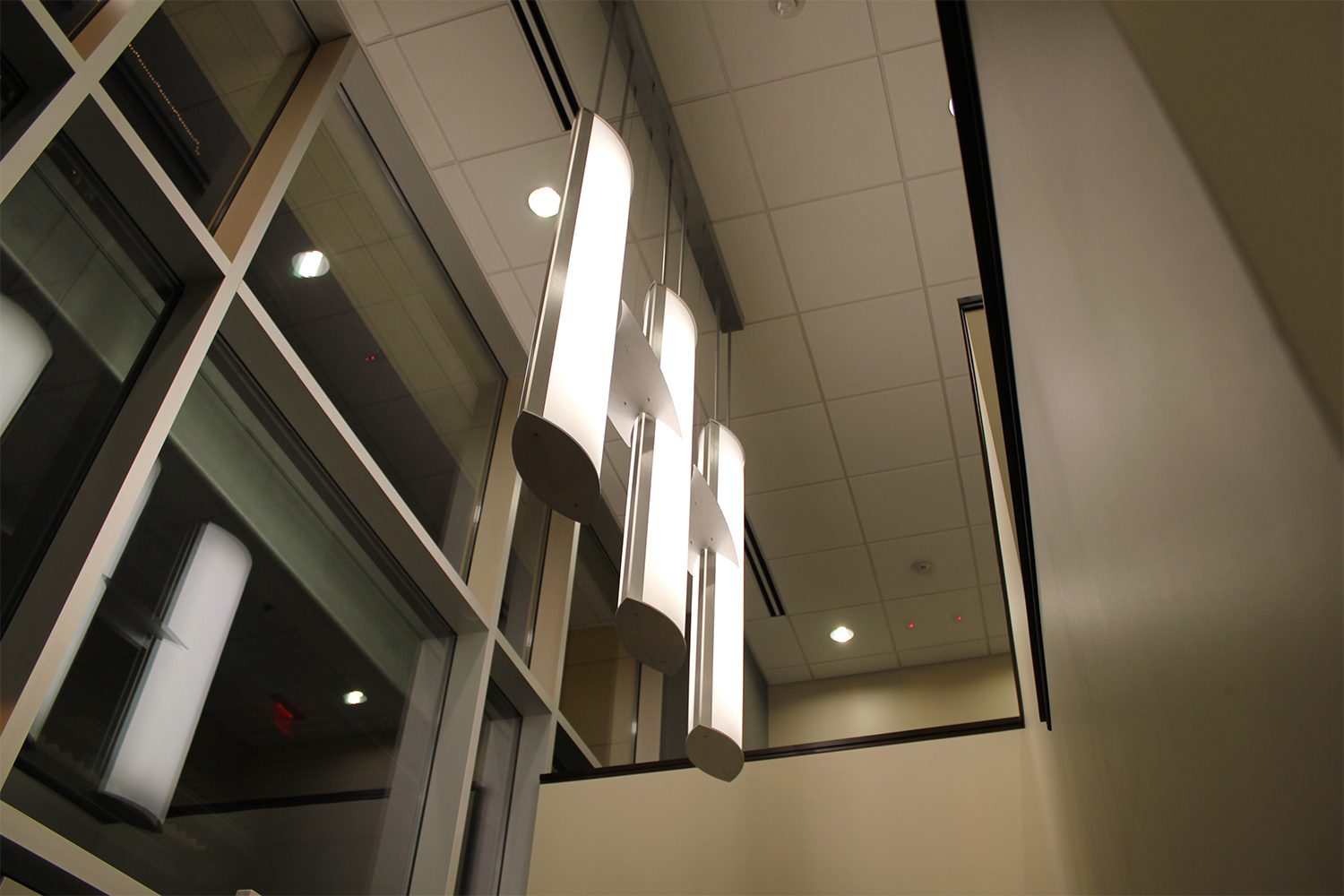 Air Foil pendants hung in a group of three for a stylish hospital lighting design.