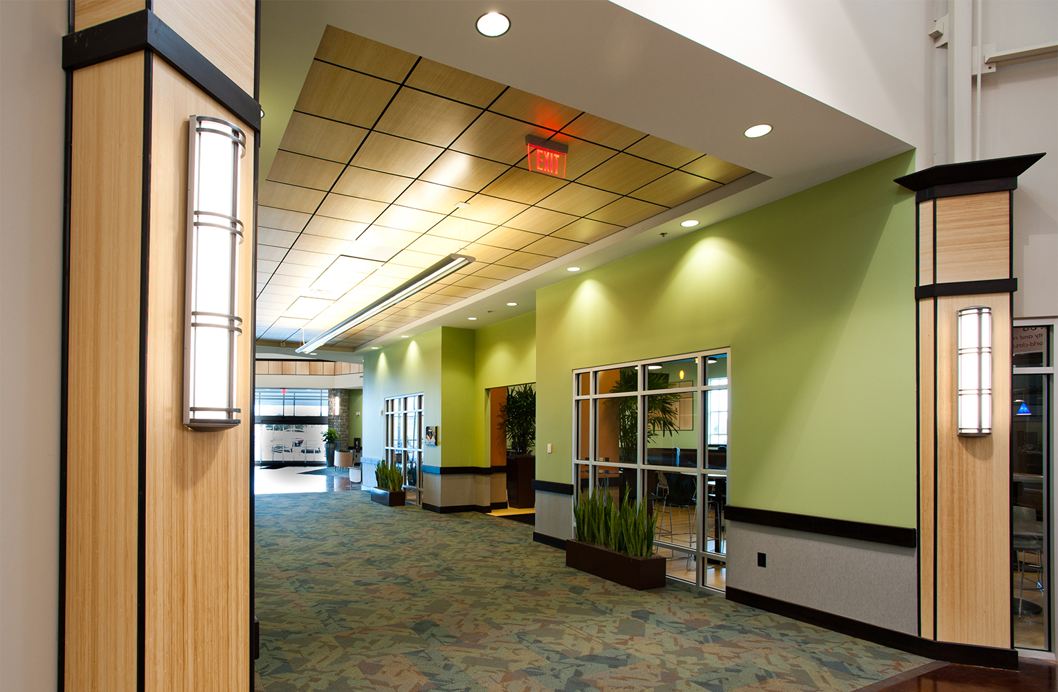 Avatar indoor wall sconces with bar accents are shown here in a modern hospital lighting design.
