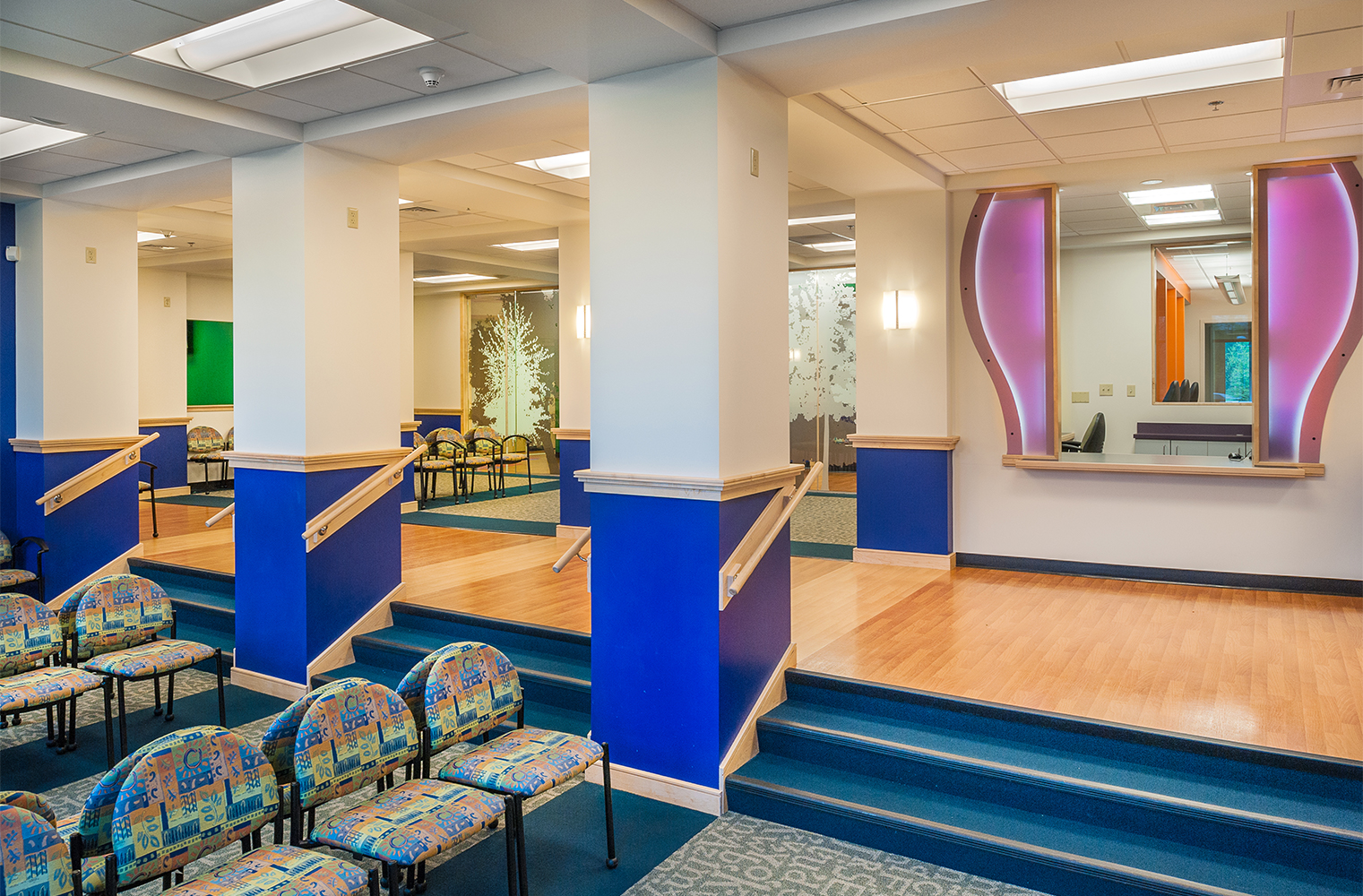 Basics wall sconces are minimal and charming for this hospital lighting design in a waiting area.