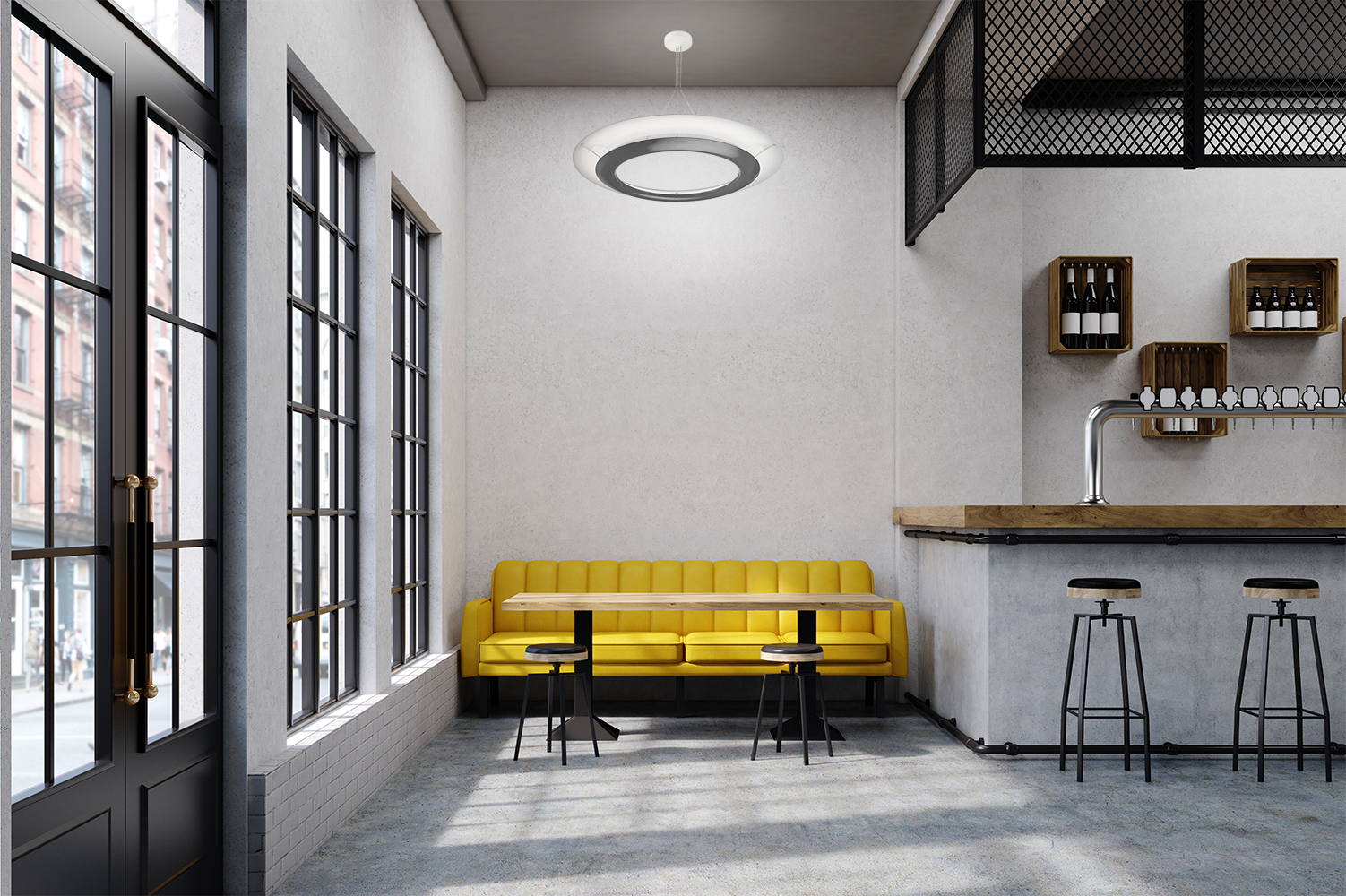 Cosmo ring pendants are perfect for commercial lighting applications, seen here above a yellow couch in a modern bar