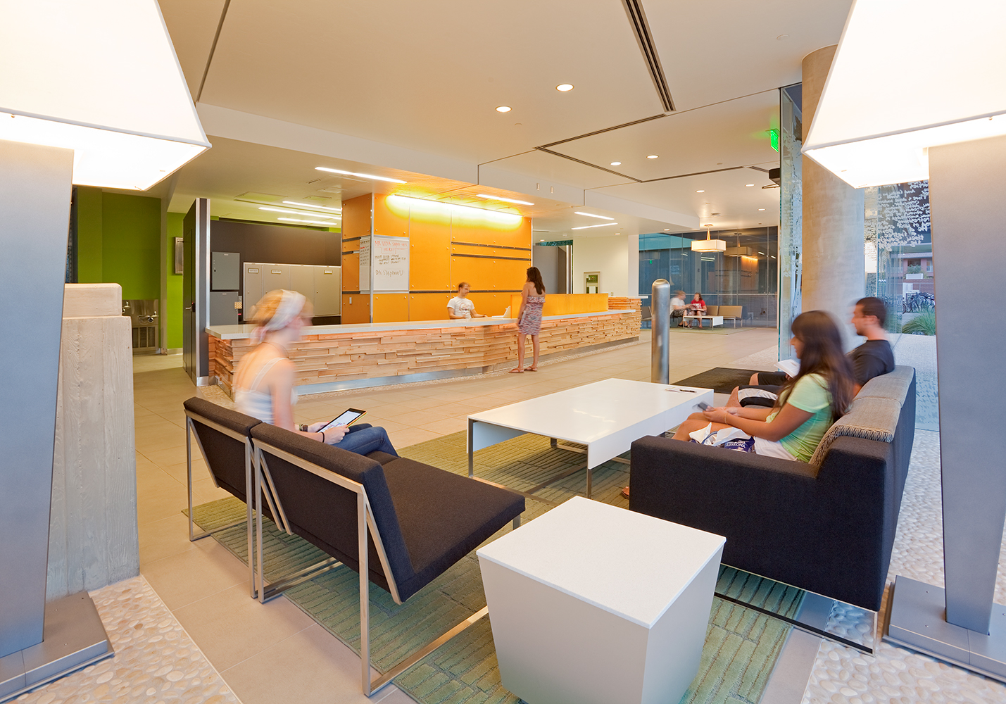 These custom light fixtures in a lobby seating area were tailored to resemble giant table lamps.