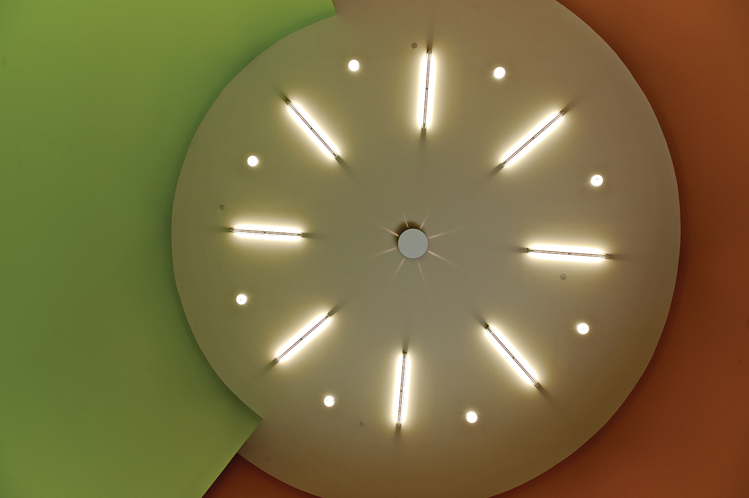 Ether ceiling mounted luminaires in a circular design for an education lighting application