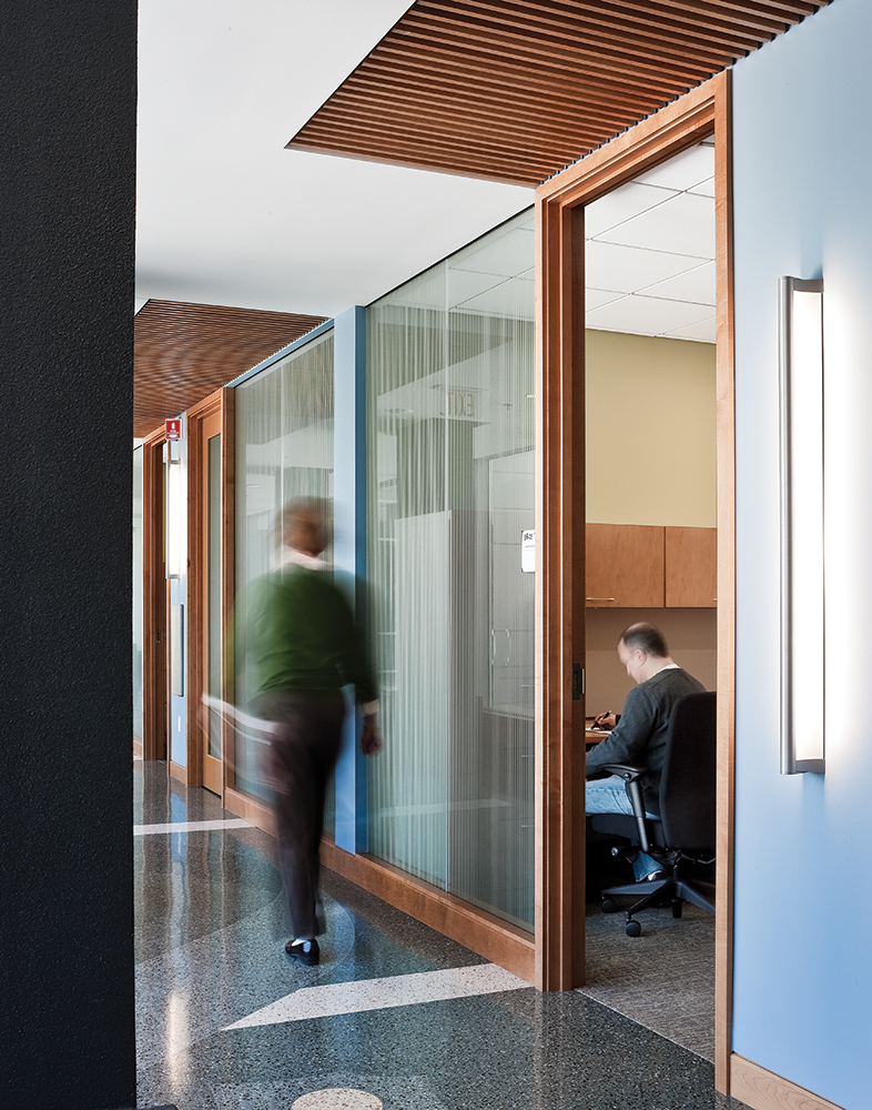 Ether in an education lighting design application, mounted vertically along a campus hallway