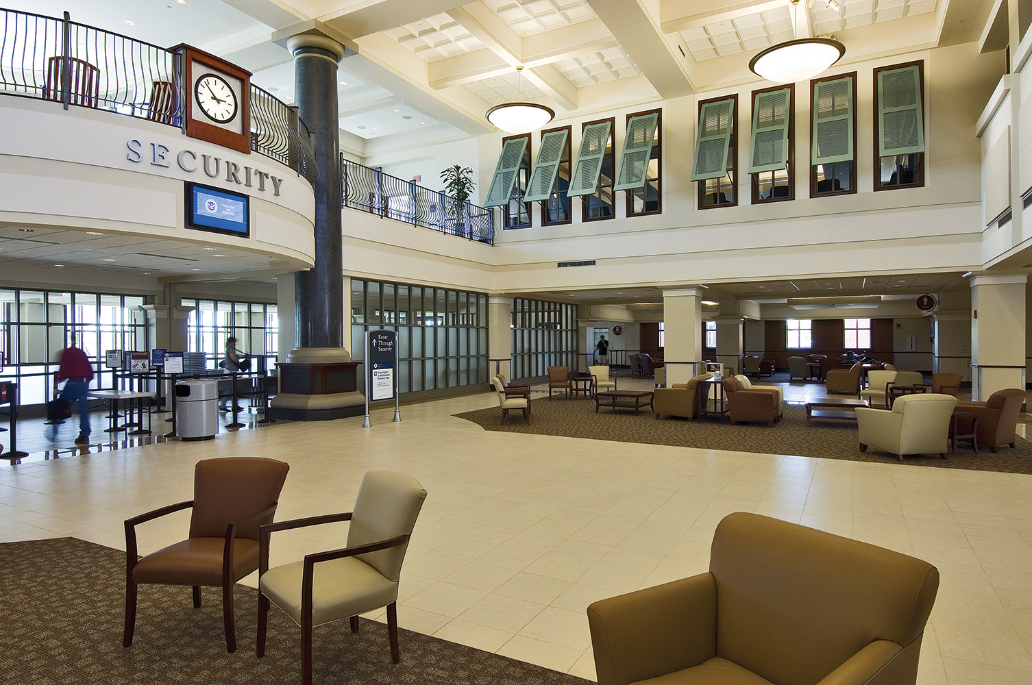 Fairfax bowl pendants provide architectural lighting for a sophisticated airport lobby