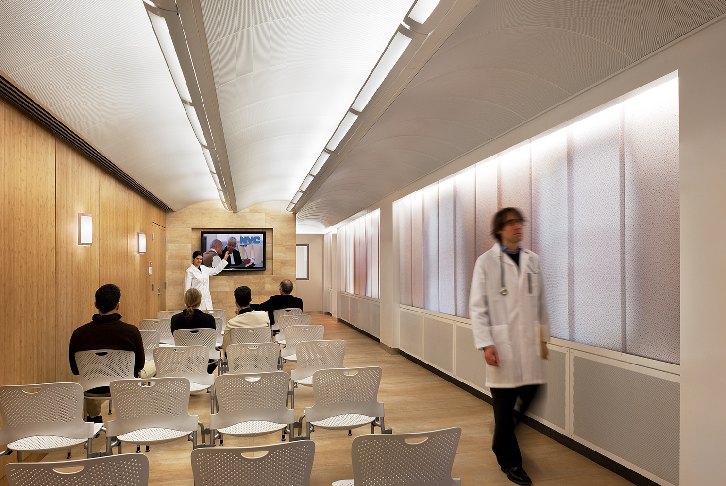 Masque modern wall sconce in a medical lighting application along a hospital meeting area.