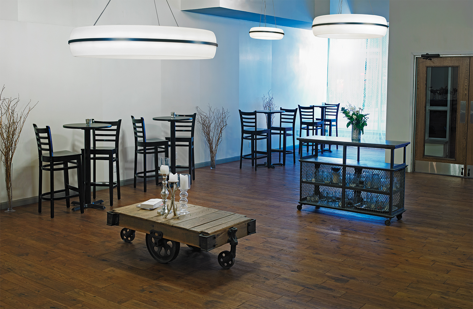 Meridian Round pendant is perfect for hospitality lighting, seen here above a small, modern café.