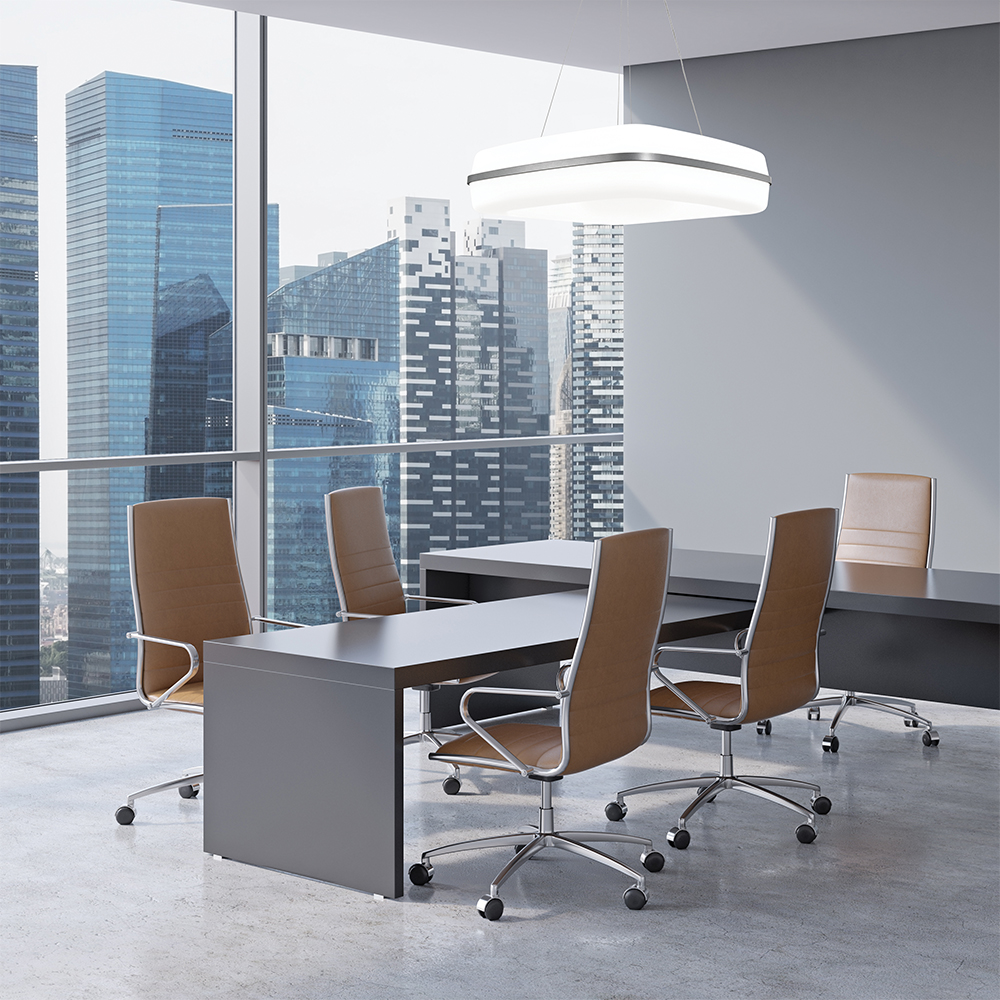 Meridian Square pendant in an office lighting design above a conference room with a large window showing a city skyline.