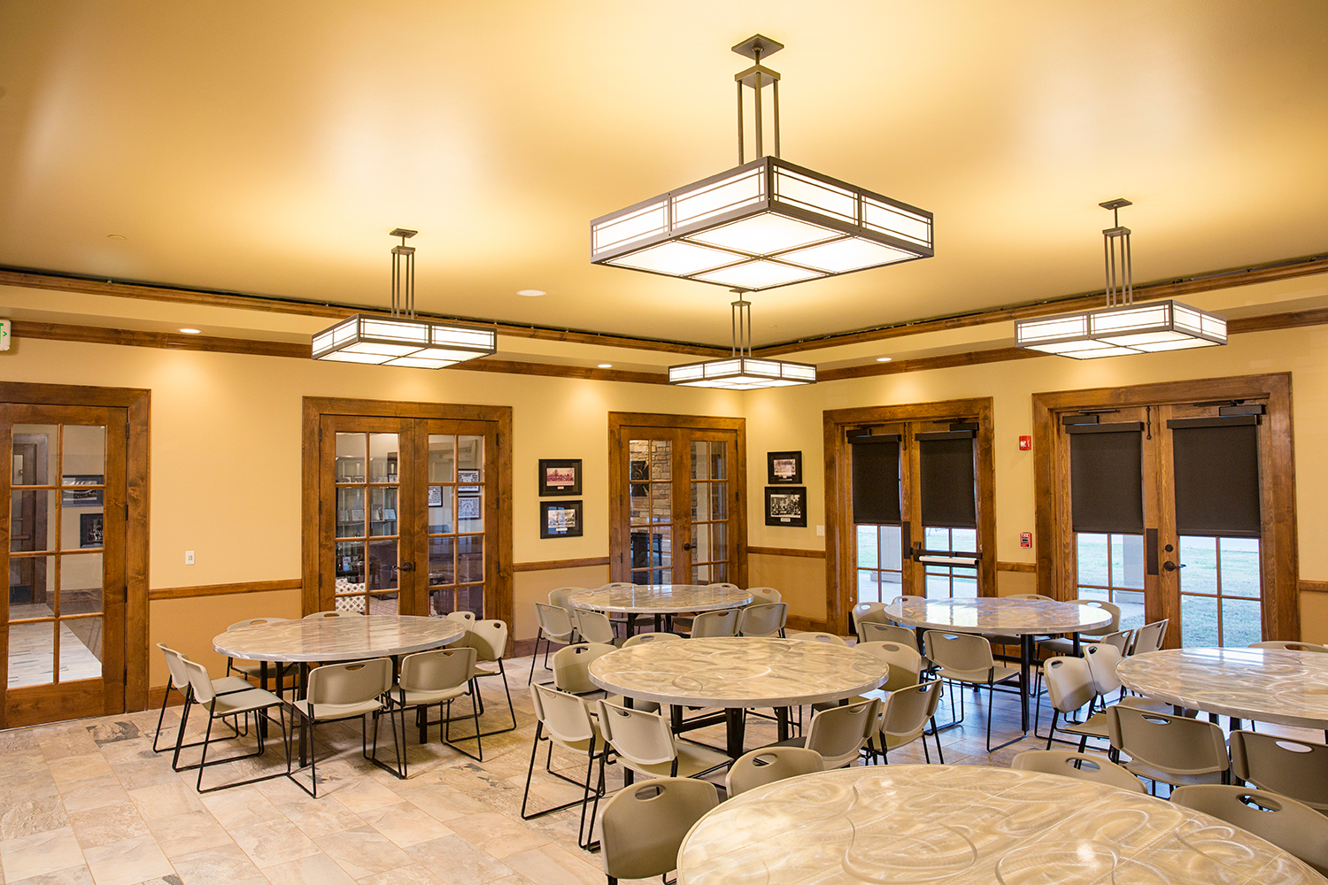 Midland Crafts pendants enhance educational interior design in a residence hall dining room.