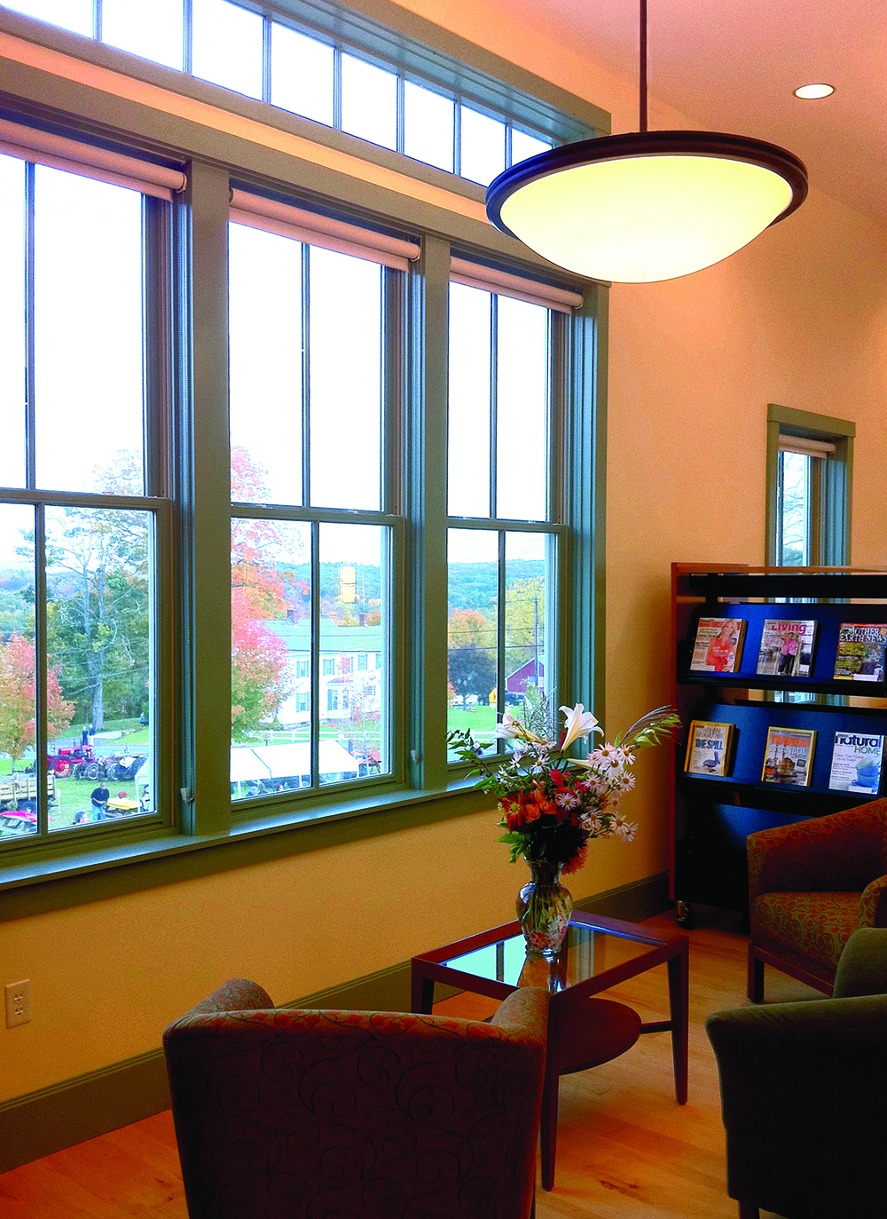 Olympia bowl pendants are perfect for timeless hospitality lighting designs, seen here above a small waiting area.