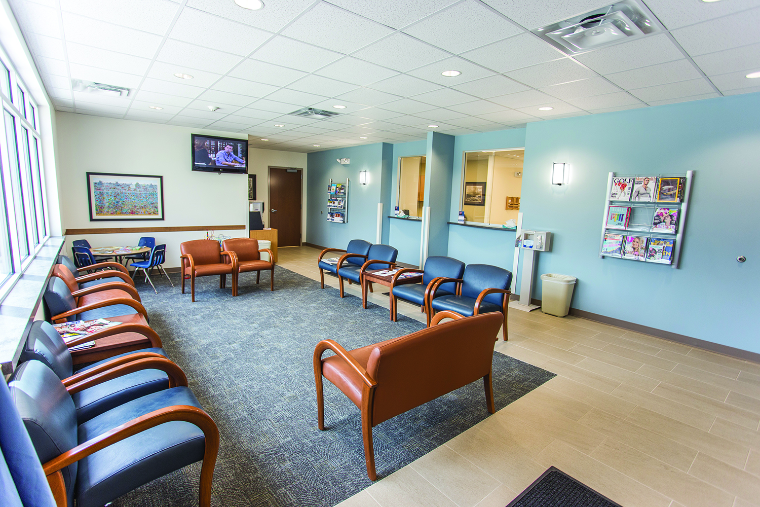 Select sconces provide stylish hospital lighting in a modern waiting room.