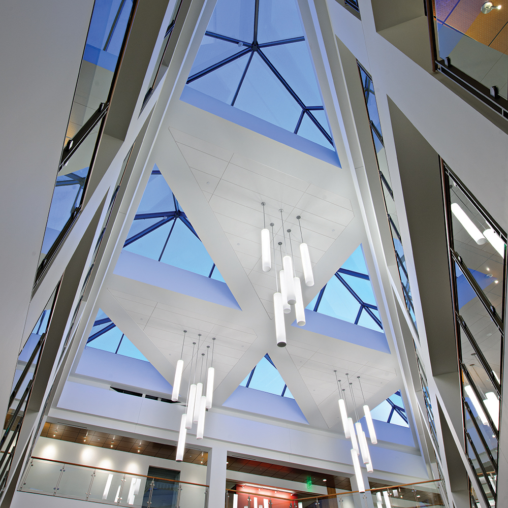 Sequence pendants enhance educational interior design in a large campus building atrium.