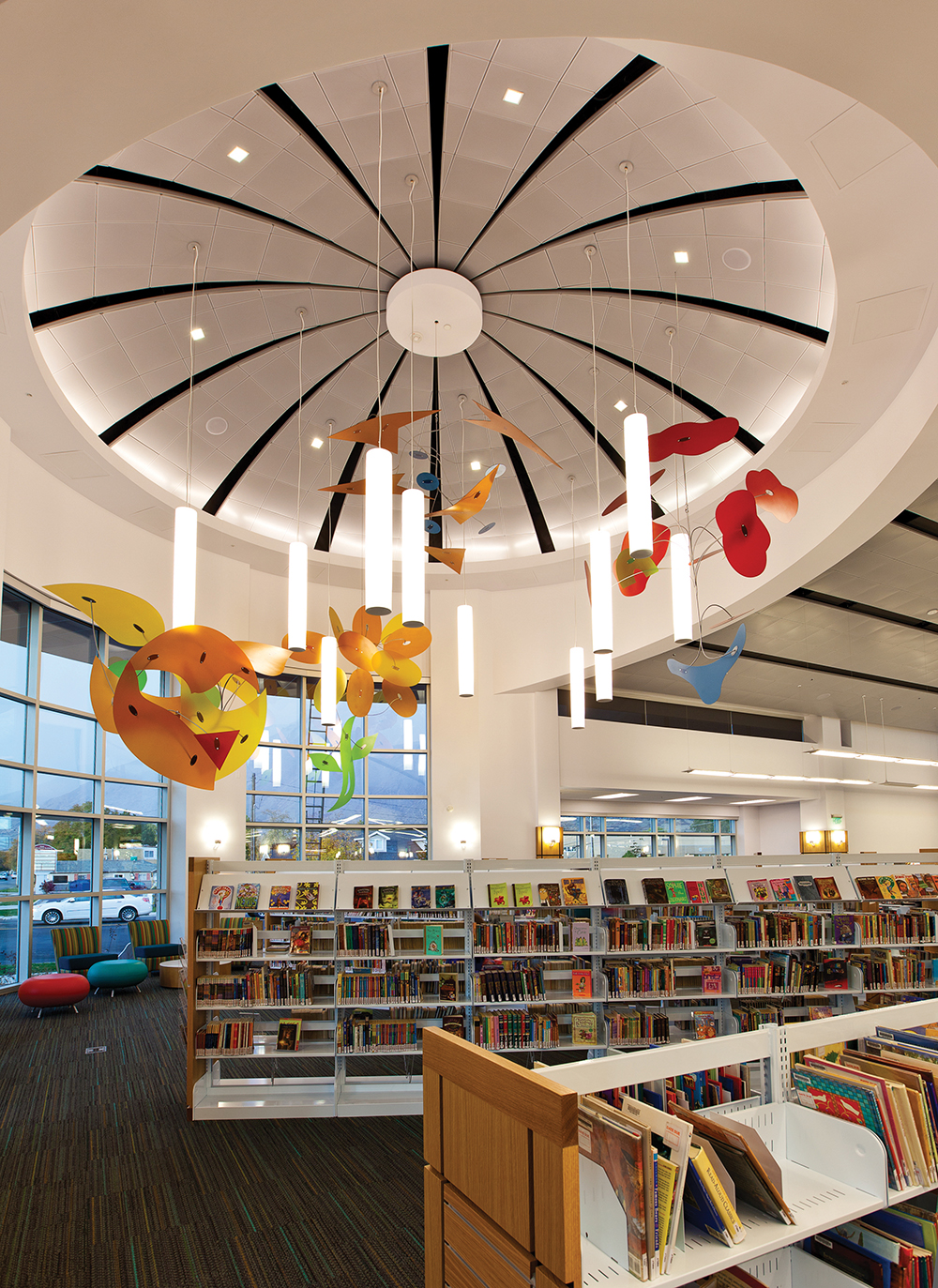 Sequence pendants in a circular configuration for a stylish central feature in a library lighting design.