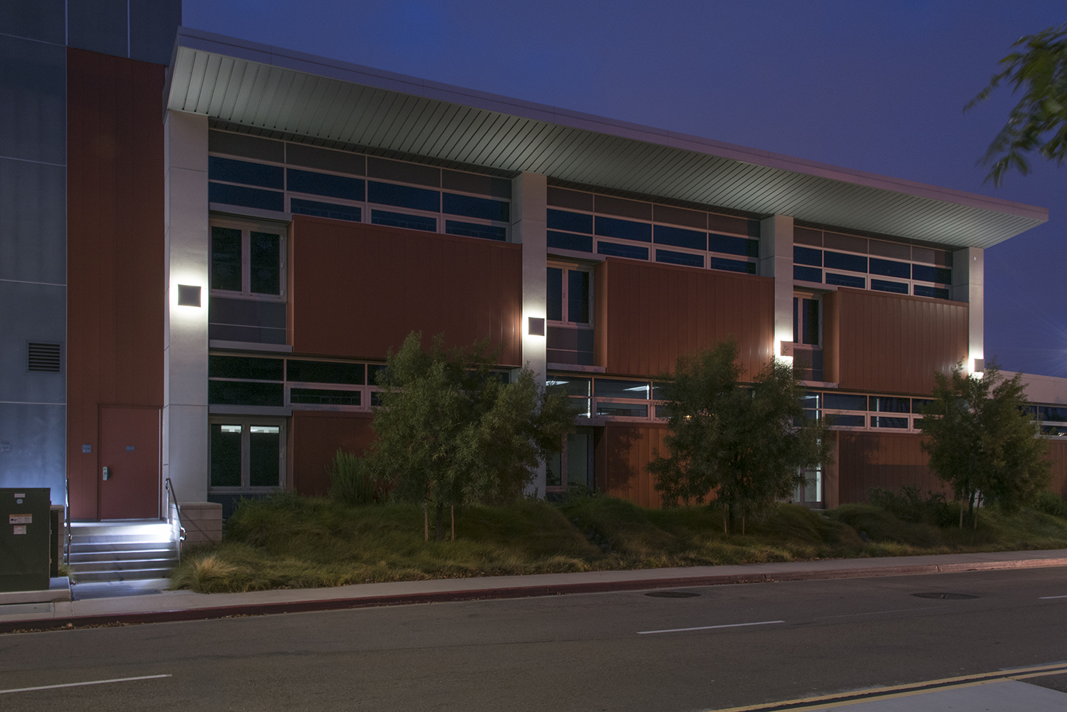 Southridge exterior lighting illuminating a campus building at night.
