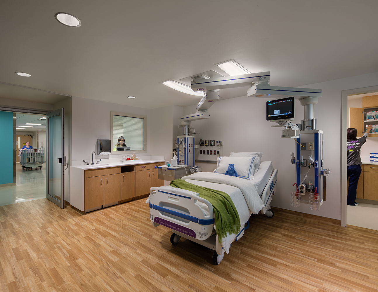 Unity tandem overbed luminaires allow for attractive patient room lighting without obstructing medical equipment.