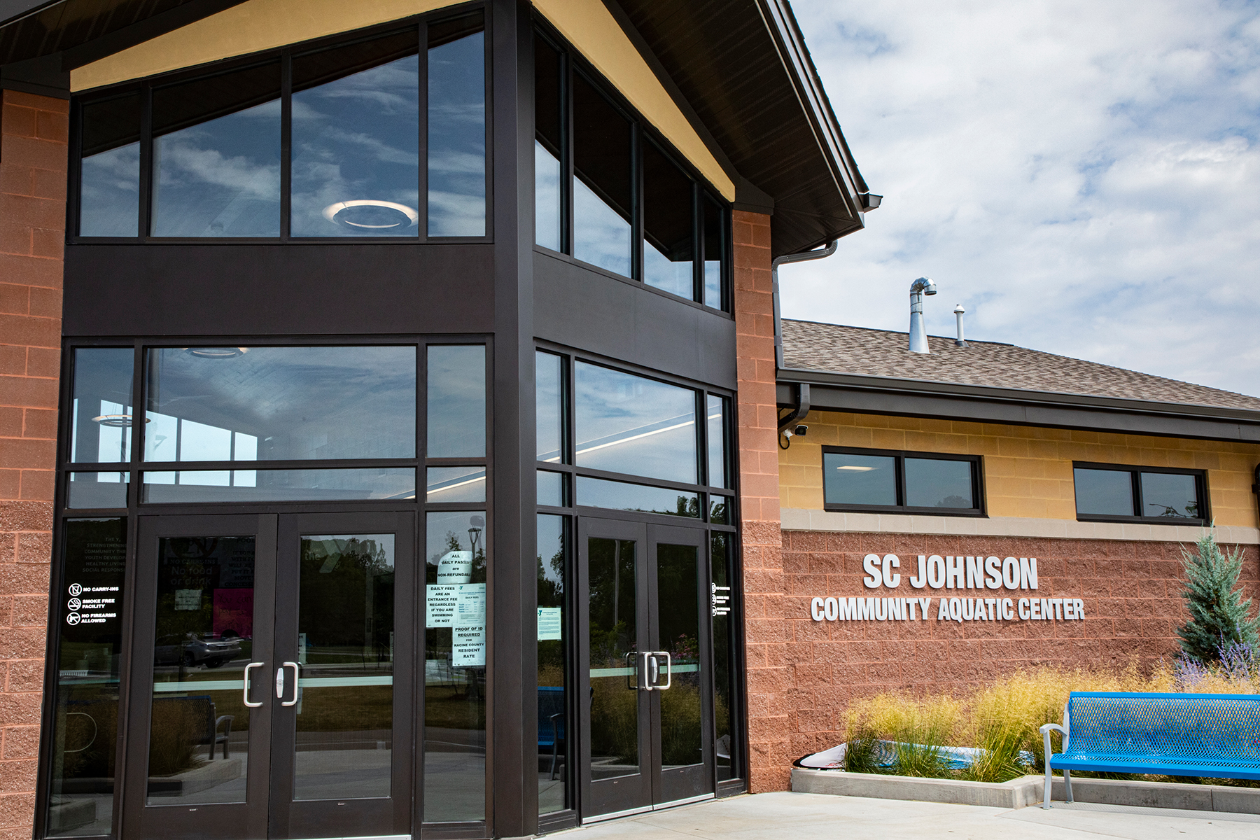 Cosmo ring pendants in a community center lobby, shown from exterior view