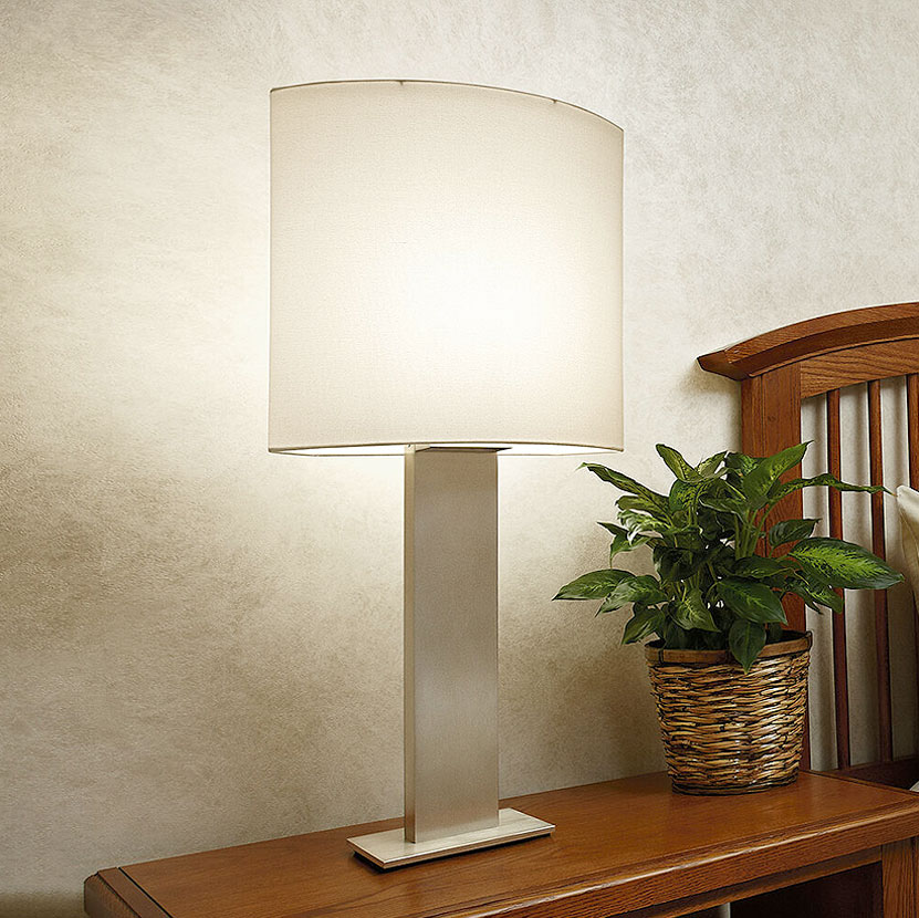 Modern table lamp mounted to bedroom side table in senior living facility 