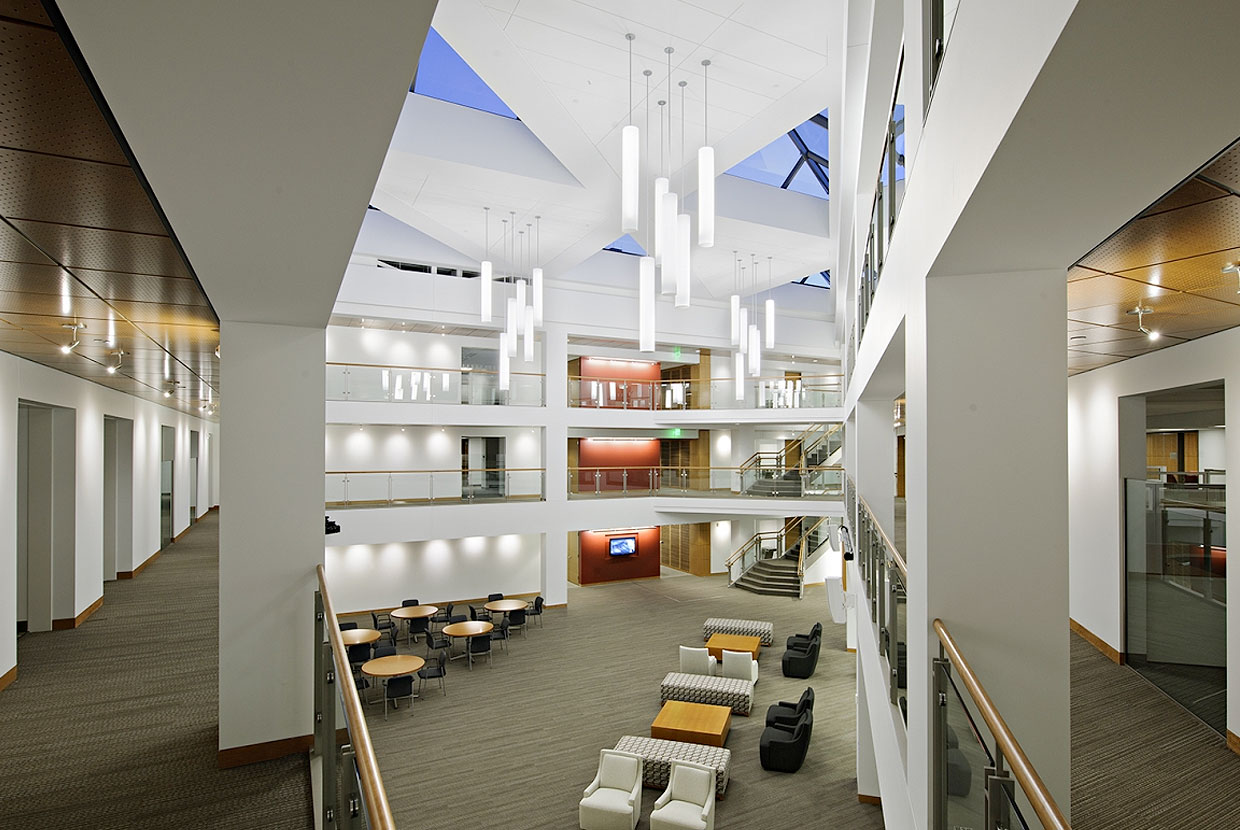 Sequence pendants enhance educational interior design in a large campus building atrium. 