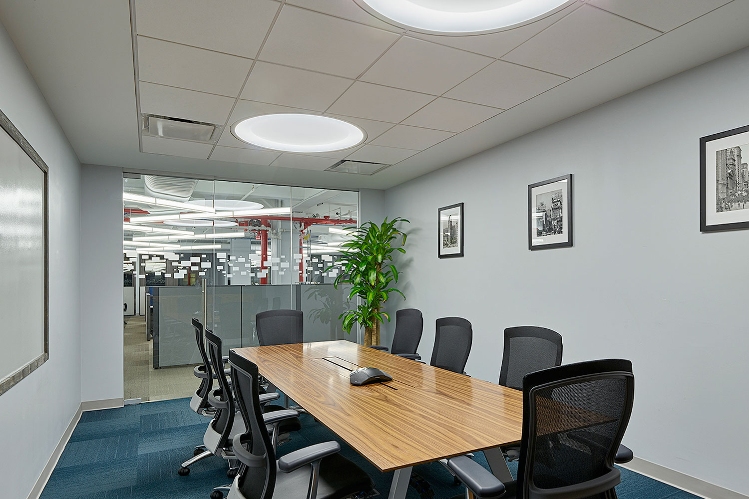 Two Large Symmetry Lights above a space for office meetings