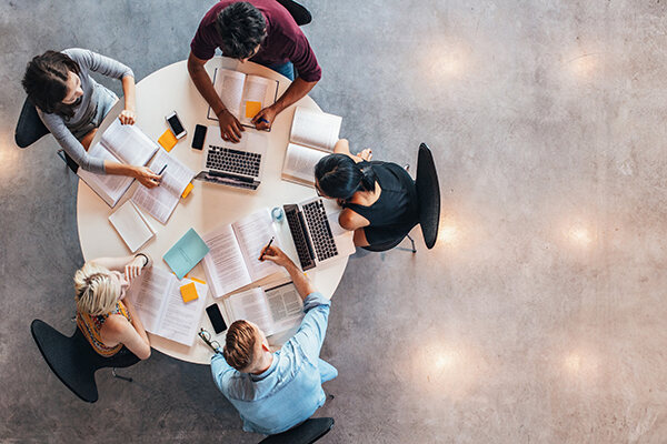 Students studying together at a round table